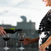 man pouring wine for woman